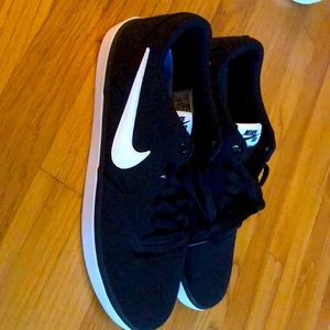 Black Nike men's sneakers, size 11, have never been worn.